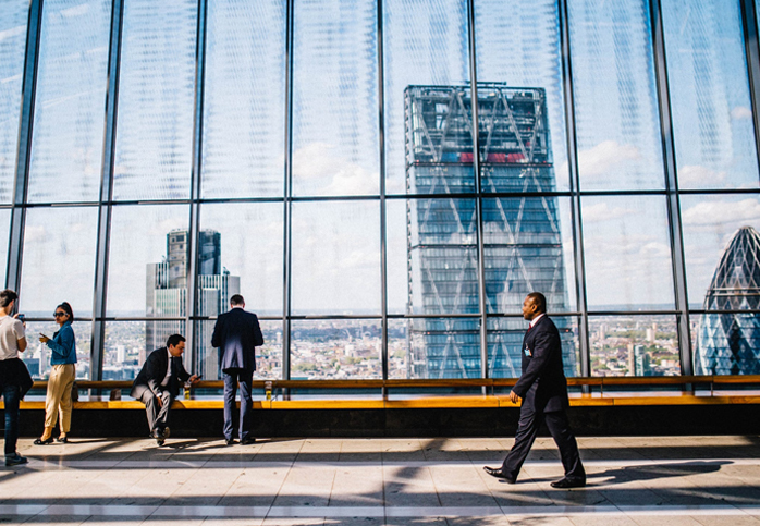 Business Professionals in a Modern Glass Office with City View
